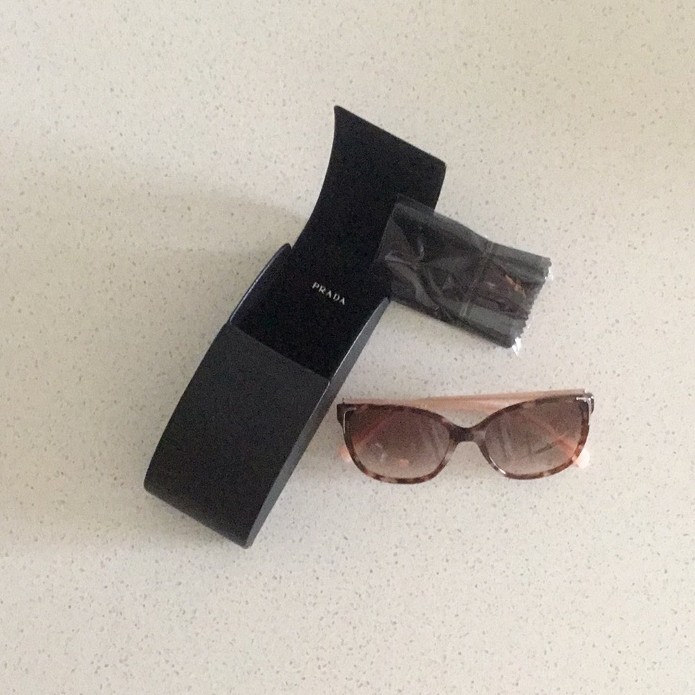 Wore 3 times authentic woman’s Prada sunglasses.
